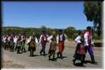 Opocznianie - Lajkonik Senior Group walking along the road to Polish Hill River.