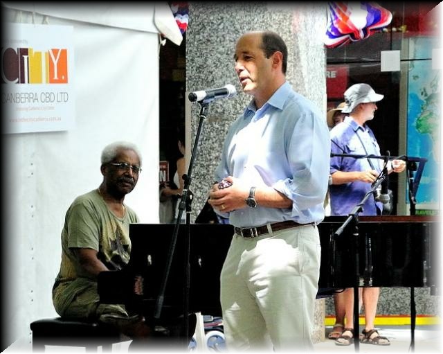 Roy being introduced by the US Ambassador, J. Bleich.